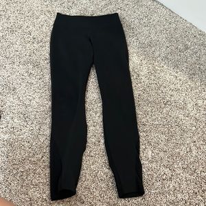 women black nike leggings with see through on back of calf’s